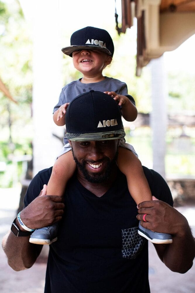 a father and son wearing aloha hats from double portion supply swag bags swag bag idea swag bags next event power bank