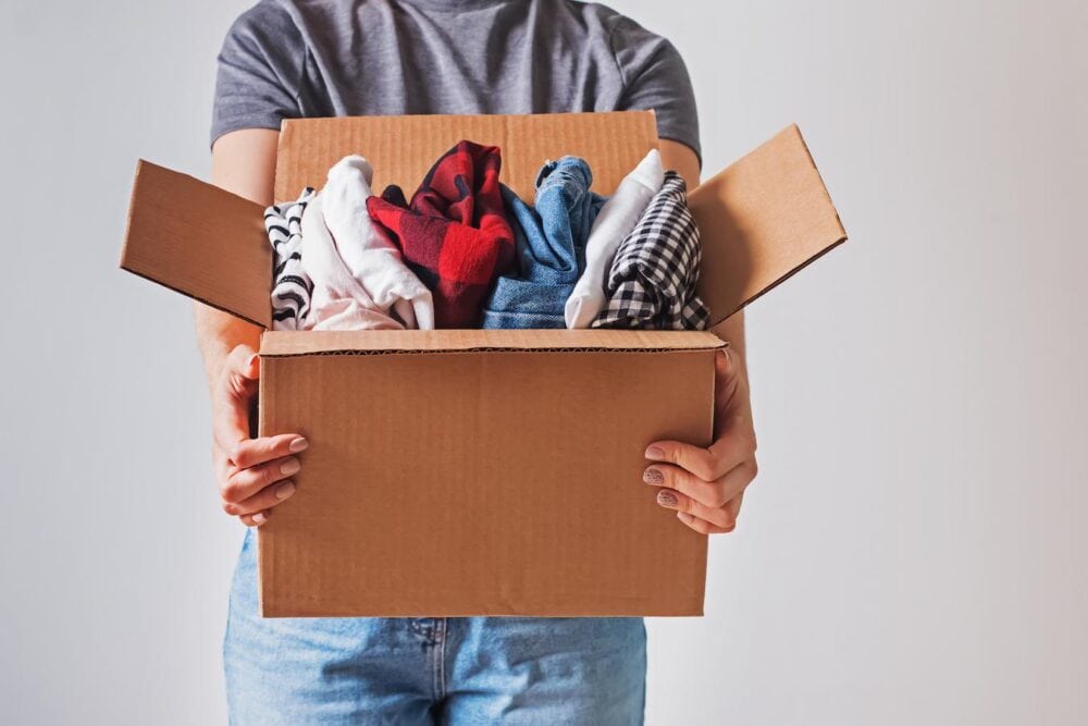 someone holding a box of clothes ideas cap idea wear hard hat t shirts ideas cap hat idea idea cap ideas hat cap cap